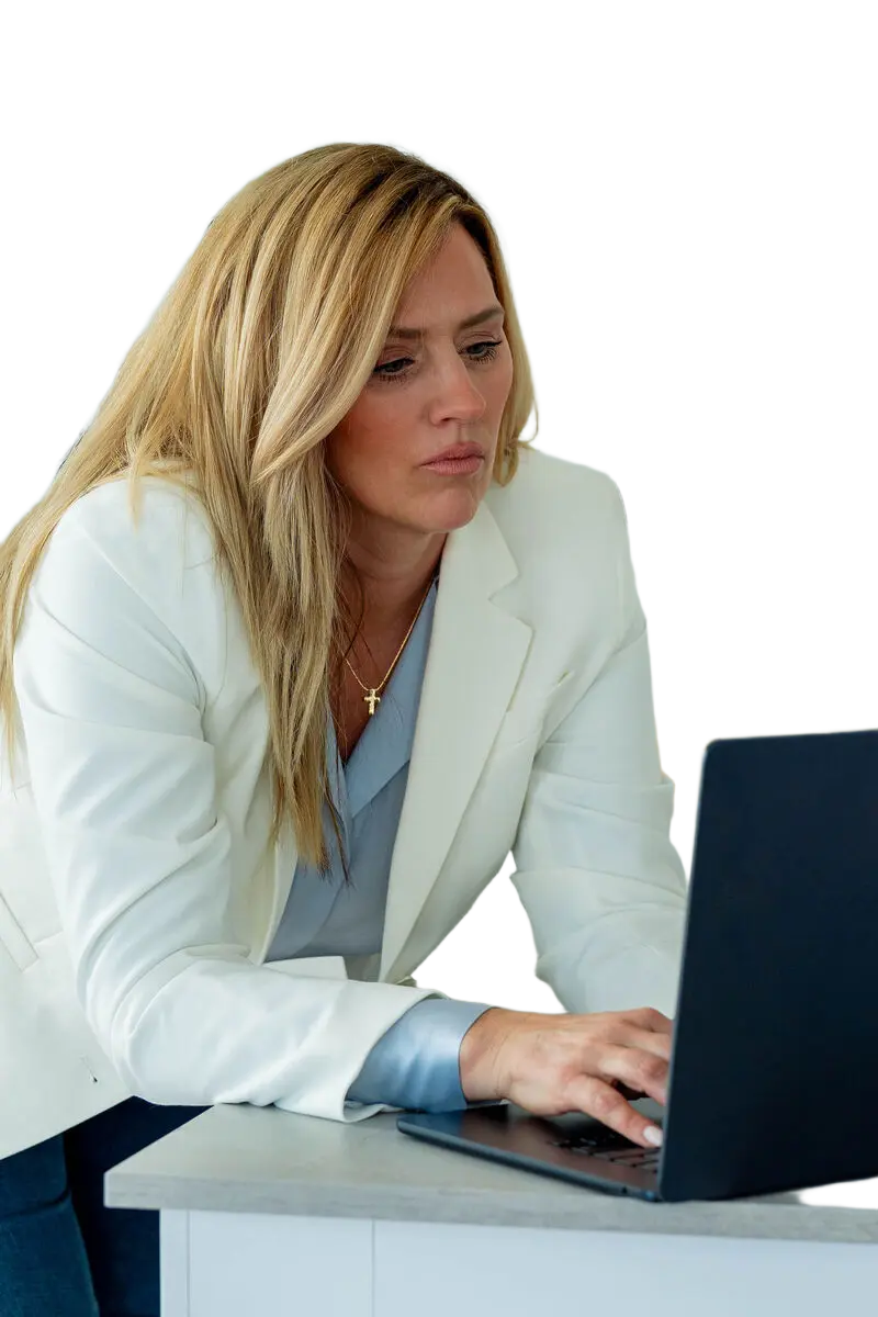 Terri from Growth and Grace Digital Labs working at her laptop