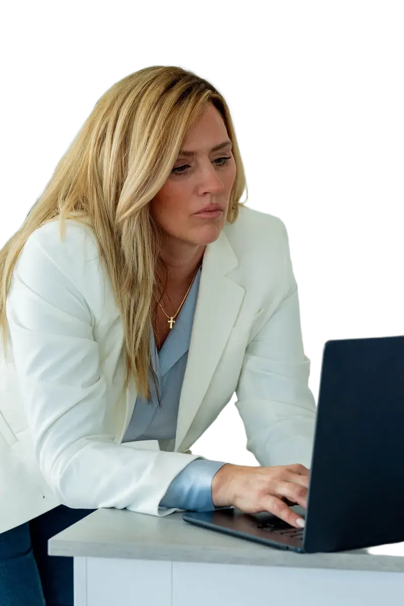 Terri Smith, founder of Growth + Grace Digital Labs, at her laptop